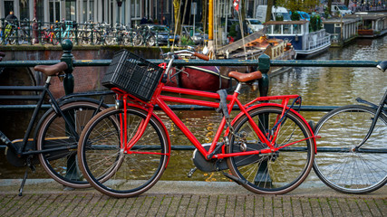 Fototapeta na wymiar Bicycles parked on a bridge in Amsterdam, The Netherlands, October 13, 2017