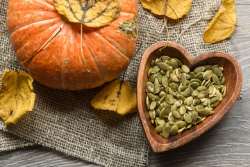 pumpkin seeds in a wooden bowl