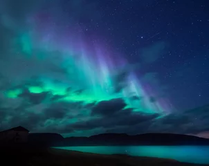Fototapeten The polar arctic Northern lights aurora borealis sky star in Norway Svalbard in Longyearbyen the moon mountains © bublik_polina
