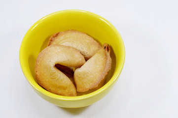 fortune cookies in yellow bowl