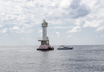 Tower of the lighthouse in the open sea.