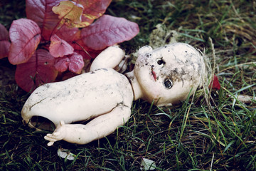 Old broken doll at the dump