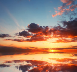 Beautiful sunset over the ocean with dramatic autumn sky. Abstract natural composition