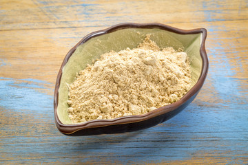 maca root powder in a leaf bowl