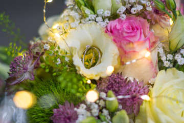 wedding rings in flowers