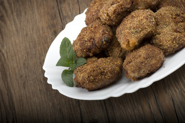 plate of meatballs on the wooden table