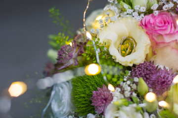 wedding rings in flowers