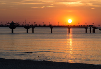 Fototapeta na wymiar Pier in Miedzyzdroje resort - Baltic seascape at sunset, Poland