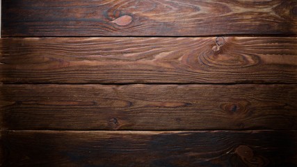Naklejka premium Brown wooden background. Top view. Free space for your text.