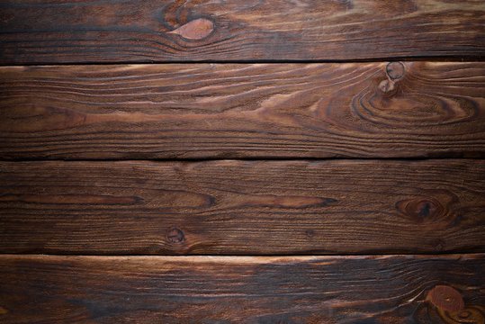 Brown wooden background. Top view. Free space for your text.