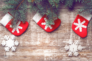 Christmas decorations on old boards. Christmas background. Christmas Socks. New Year background. Xmax background. Christmas tree. Toned image.