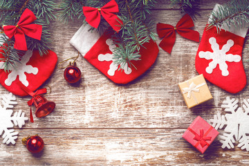 Christmas decorations on old boards. Christmas background. Christmas Socks. New Year background. Xmax background. Christmas tree. Toned image.