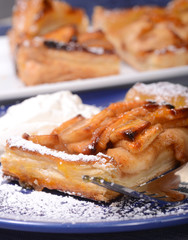 Apple tart with whipped cream and apricot glaze