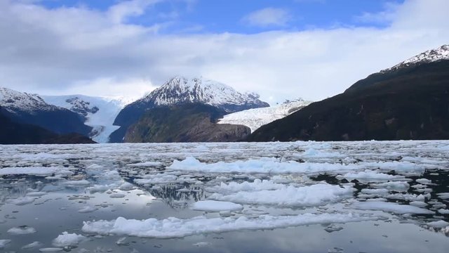 Glacier in Alaska with water reflection landscape