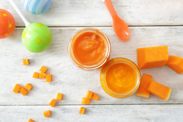 Jars with baby food on table