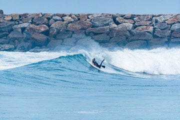 Bodyboarder surfing ocean wave