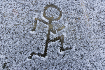 drawing on snow in winter, pattern on winter glass
