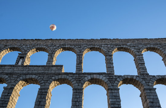 Segovia, Spain - October 14, 2017: Hot Air Ballooning Early in the Morning Near the Roman Aqueduct