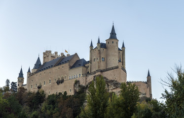Fototapeta na wymiar Segovia, Spain - October 14, 2017: Castle of Segovia situated on a hill