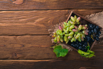 Grain Grape. On a wooden background. Top view. Free space for your text.