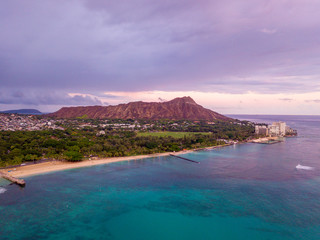 Purple Diamond Head sunset aerial view over Waikiki beach