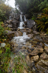 Obraz premium Waterfall from ravine in autumn, long exposure