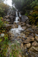 Waterfall from ravine in autumn, long exposure