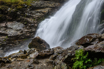 large Waterfall from ravine in autumn, long exposure