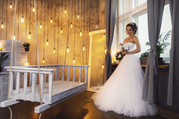 Young happy bride wearing beautiful lush dress