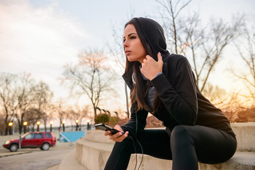 Young woman siting on the stairs