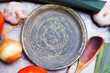 Vintage plate, vegetables mix and wooden spoon 