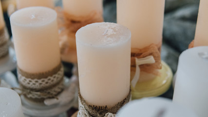 .beautiful wax candles in Boho style close-up. .Colored wax candles for spa