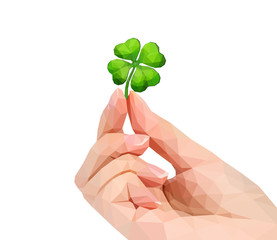 polygonal hand studio photo keeps clover in the fingers