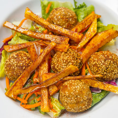 Autumn salad with pumpkin and carrot croquettes