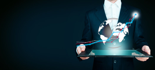 Hand holding a arrow graph on tablet