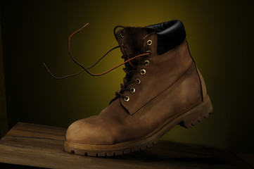 Wild boot, waterproof on yellow dark background