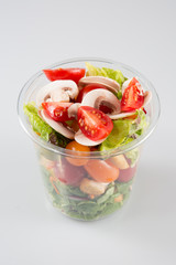 Salad in plastic container Takeaway salads on white background