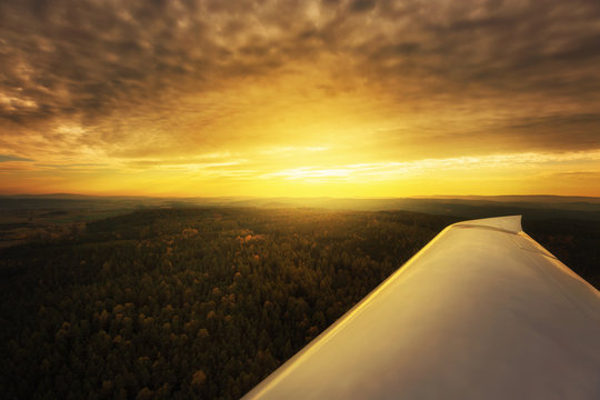 View on sunset from cabin of private light plane.
