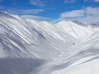 Winter mountains, snow valley in Italian Alps. Livignio