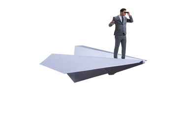 Businessman flying on paper plane in business concept