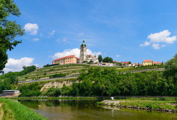 The historic Mělník castle and church tower of St. Peter and Paul at the confluence of the Vltava...
