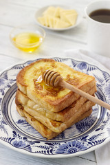 French toast served with honey and cheese.