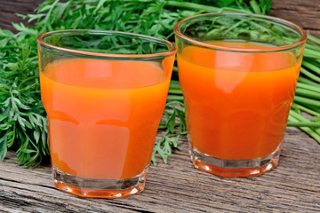 Carrot juice in a glasses on table