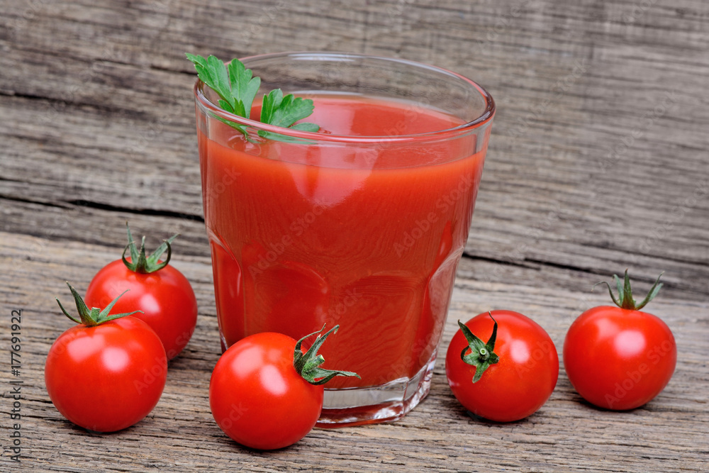 Canvas Prints Glass of tomato juice on table