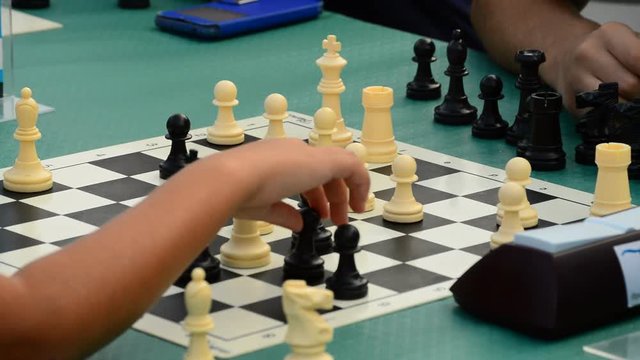 Chess players playing a game in a outdoor chess tournament