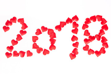 Happy new 2018 year, number with red hearts above white backgrou