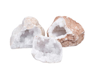 Collection of clear crystal quartz geodes with crystalline druzy center isolated on white background