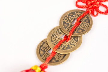Three ancient Feng shui metal lucky coins isolated above white b