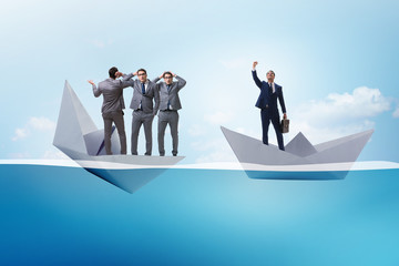 Obraz premium Businessman escaping sunken paper boat ship