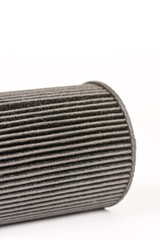 Old used and dirty car fuel filter isolated above white background